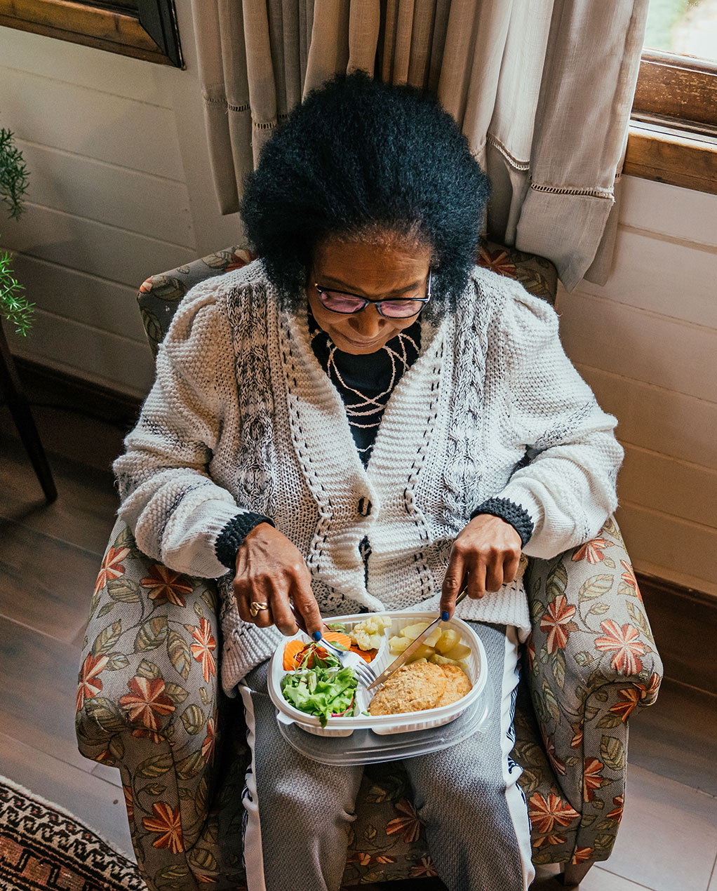 neighbor seated, enjoying a meal
